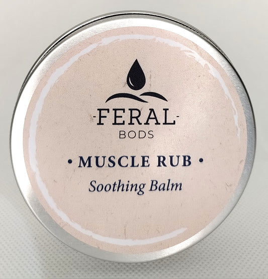 Feral Bods Muscle Rub Soothing Balm container on a light gray background. Tallow skincare